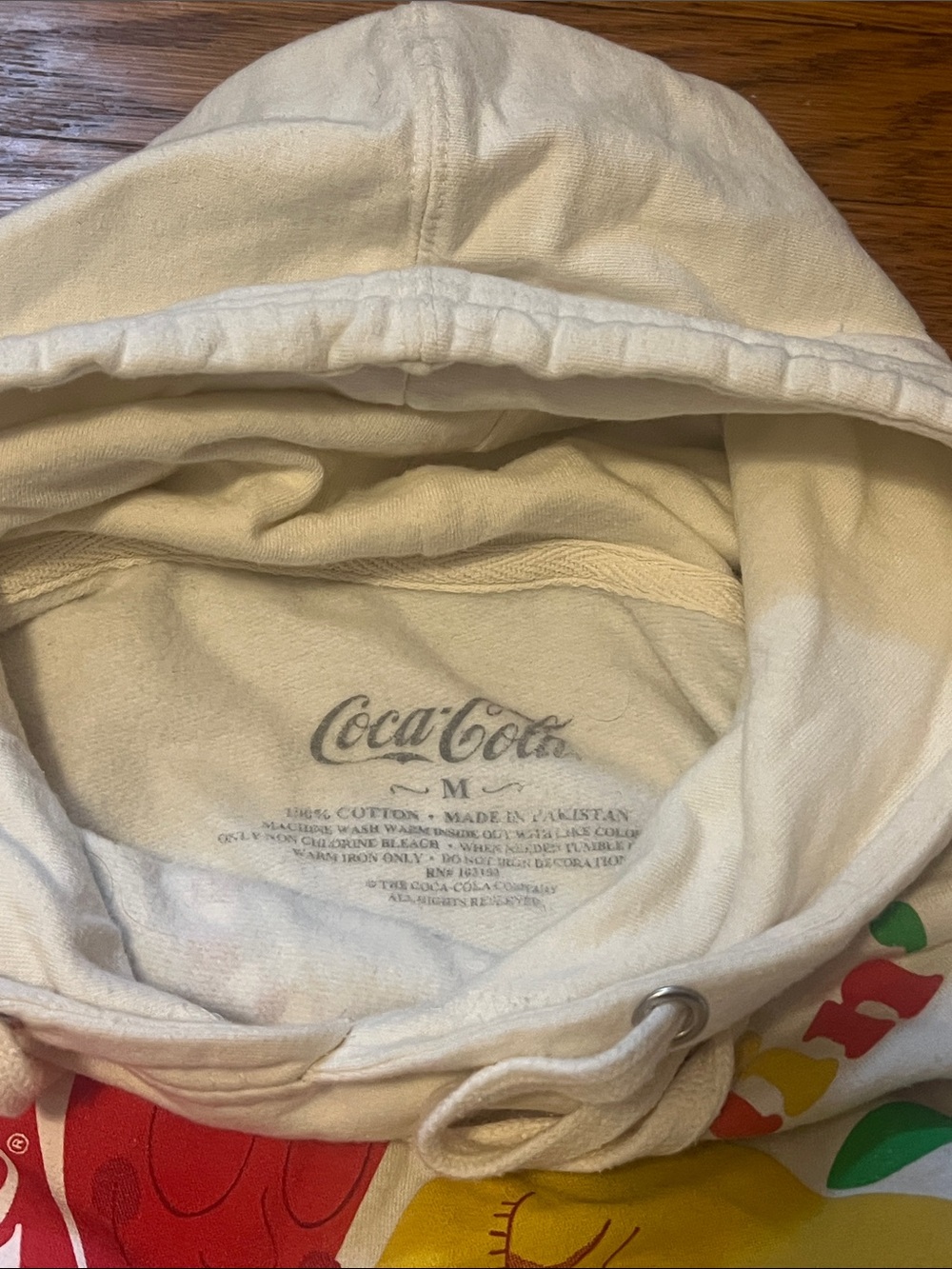 Coca Cola Cream Hoodie with Red & Yellow Peach Graphic - Picture 2 of 2